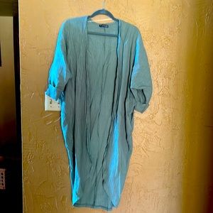 Light green cardigan that can be worn casually or dressed up.